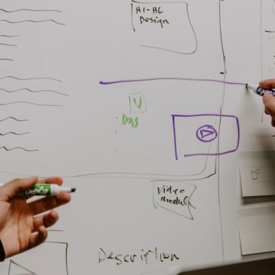 two-people-drawing-on-whiteboard-26mjgncm0wc